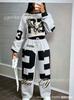 Digitaldruck zweiteiliges Set, kontrastierender gerippter kurzer Pullover, elastische Taille, fließende, weite, bodenlange Hosen