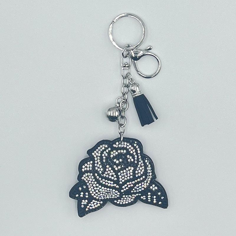 

Ключниця з квітами троянди зі стразами та китицею - Модний металевий аксесуар срібний/чорний