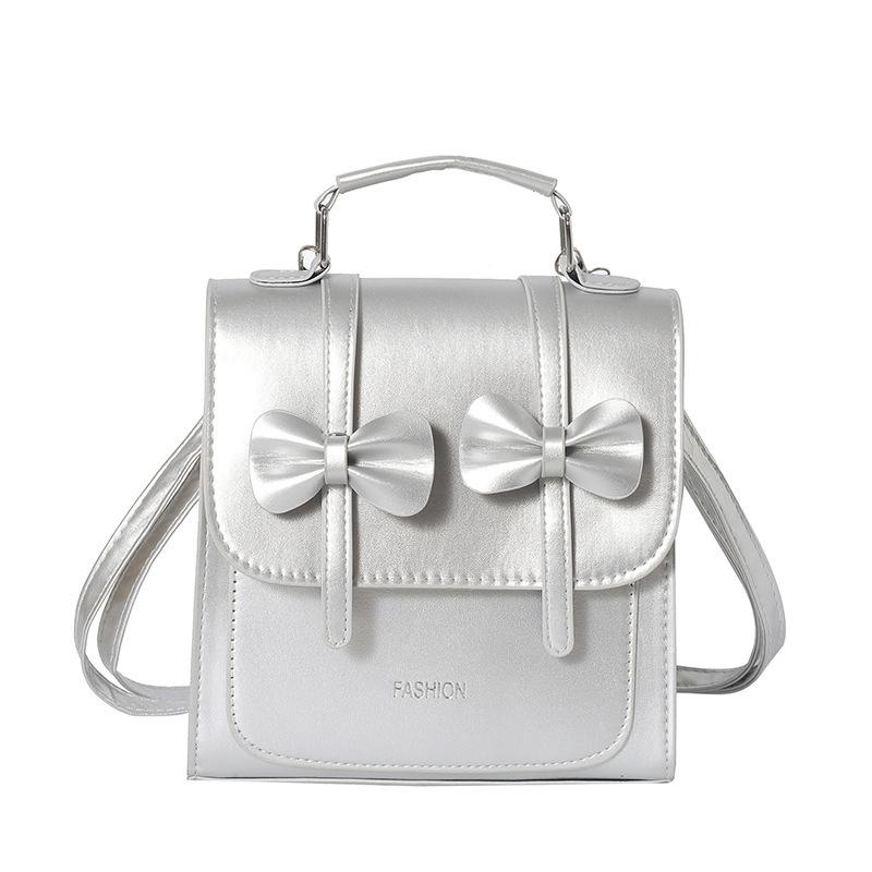 South Korea solid color college style commuter backpack women 2025 new trend bow portable shoulder messenger bag