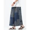 Pantaloni cropped a gamba larga con stampa geometrica etnica da uomo