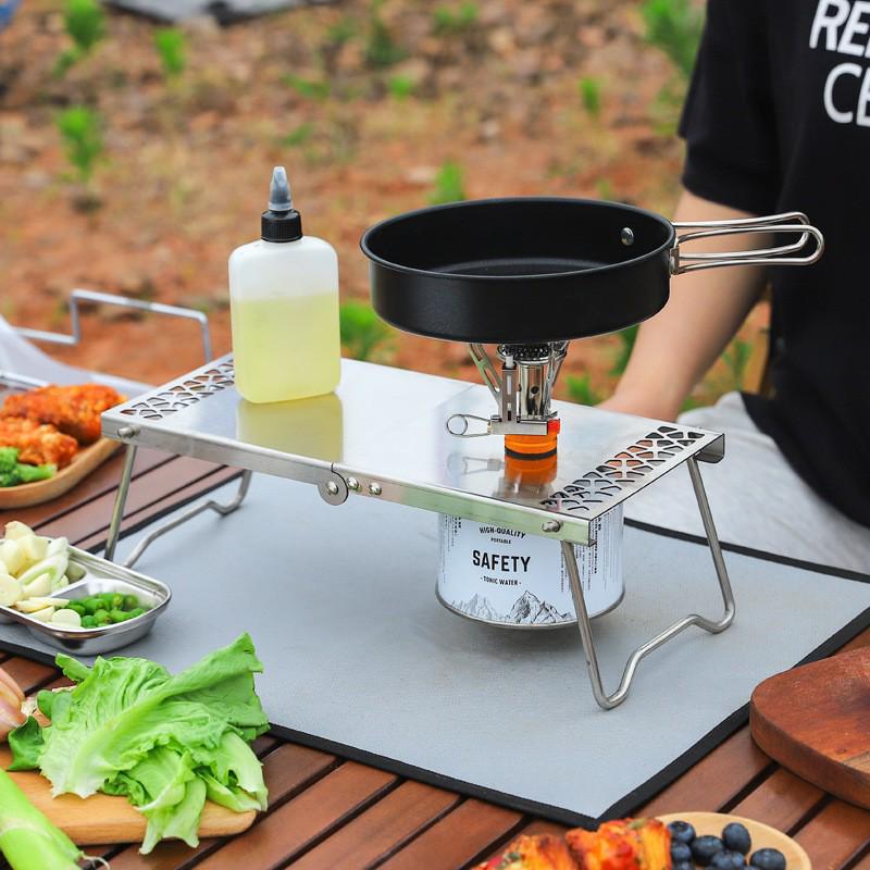 Stainless Steel Portable Folding Table: Multi-functional Tea, Picnic, Camping, Hiking, and BBQ Table with Gas Stove Compatibility.