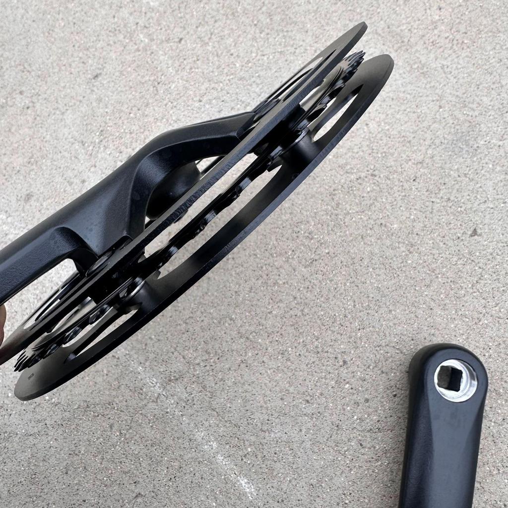 Compact Folding Road Bike with 46-Tooth Single-Piece Crankset and Double Chainring Guard