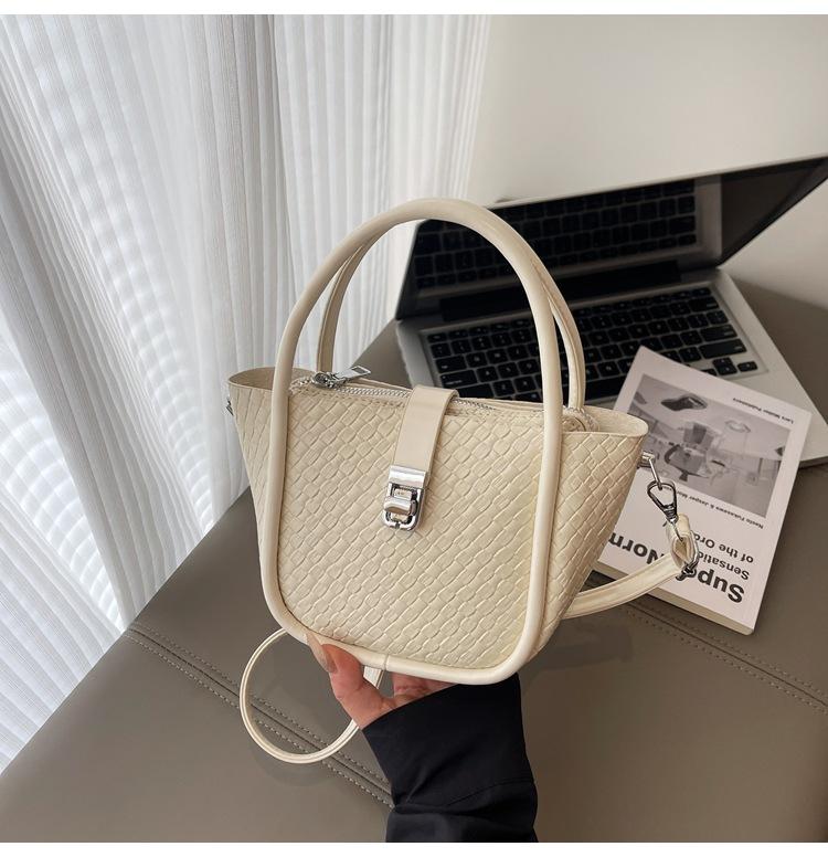 Beliebte Tasche Damen 2025 Sommer neue Mode gewebtes Muster Handtrage-Bucket-Bag schlichte Kinder- und Mütter-Umhängetasche