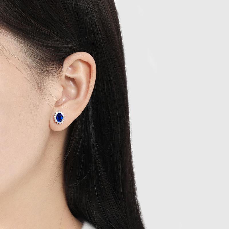 Zodiac Stone Gemstone Stud Earrings: Exaggerated Royal Blue Sapphire Sunflower Design In European and American Style.
