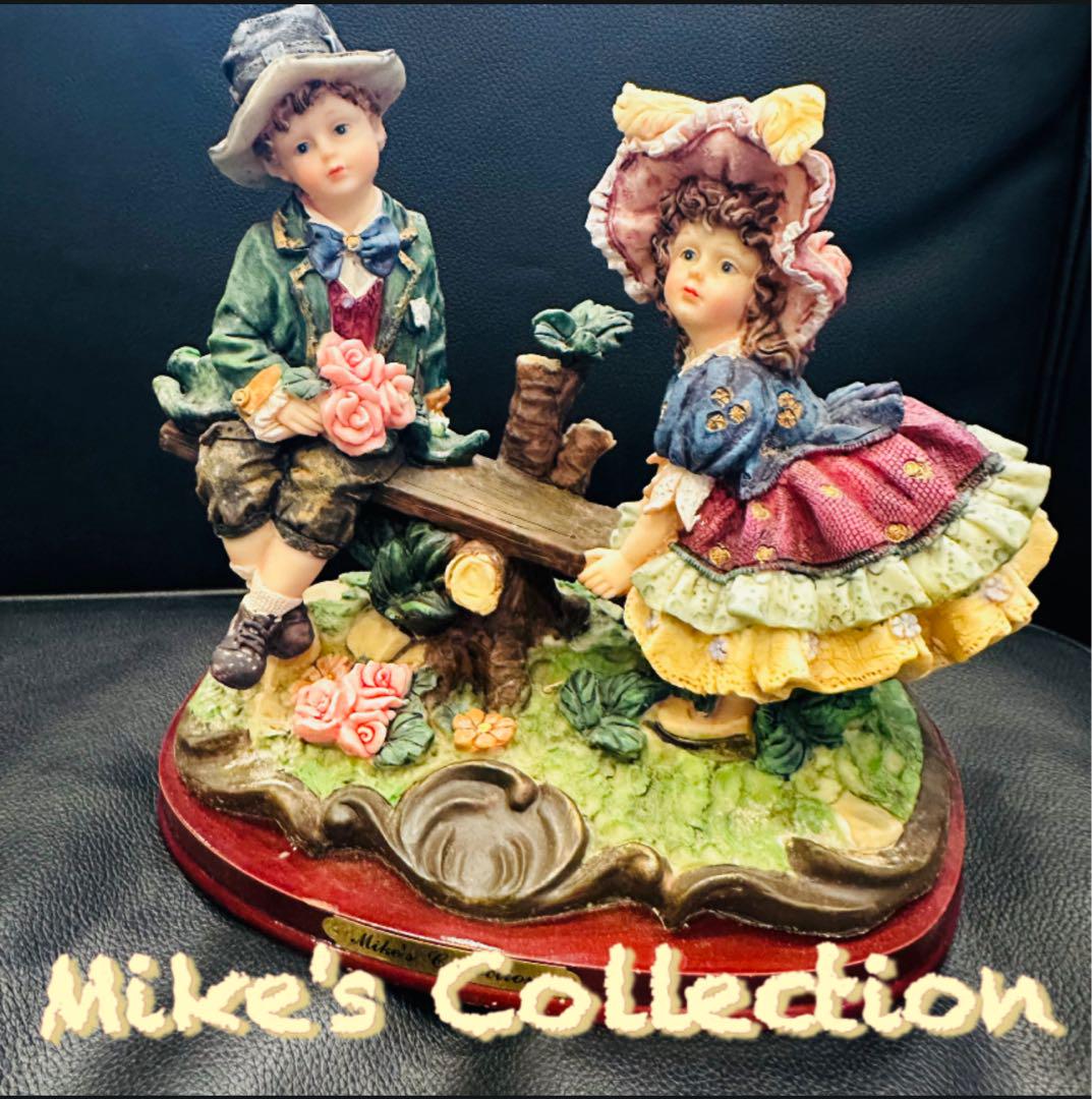 

[USED] Mike s Collection Boy and Girl Playing on a Seesaw