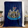 A shield with black and white stripes, flanked by seahorses, and a banner. for all seasons blanket lunch break throw gift