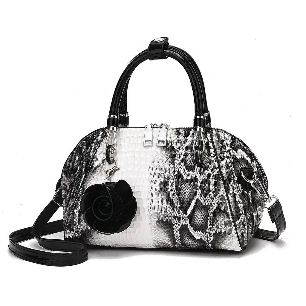 Eine neue Schlangenleder-Muster einfache Crossbody-Schultertasche große Kapazität modische PU-Damenhandtasche