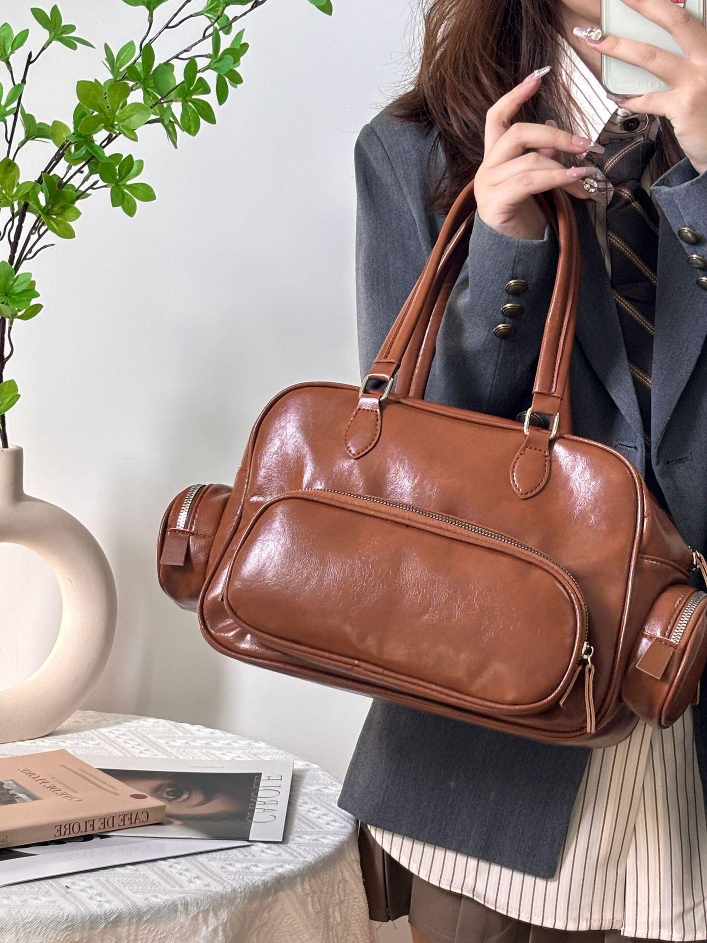 

Single shoulder retro brown bowling bag autumn and winter new versatile casual big bag commuting simple multi-pocket handbag коричневий