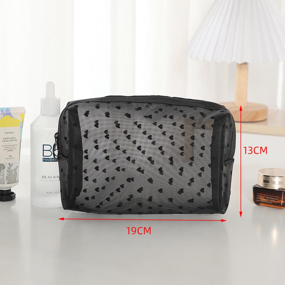 Přenosná kosmetická taška přes hranice s designem ve stylu rtěnky a zapínáním na zip