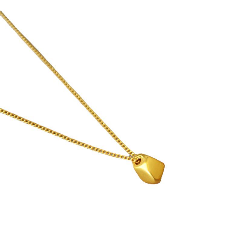 Gold-Plated Brass Pendant Necklace with Irregular Faceted Design - Retro, Versatile, and Stylish.