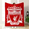 Uno scudo rosso con testo bianco, un uccello di Liverpool, torce e dettagli ornati. coperta per tutte le stagioni coperta per pausa pranzo regalo