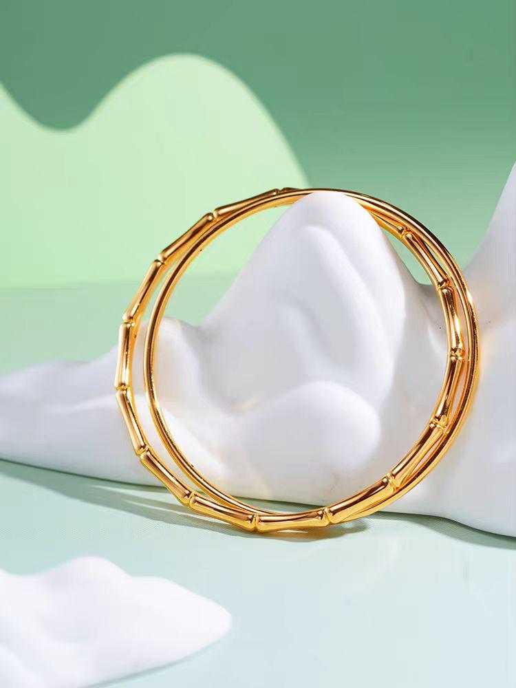 Golden Bamboo Double Ring Bangle: Chinese-Style Women's Hand Accessory.