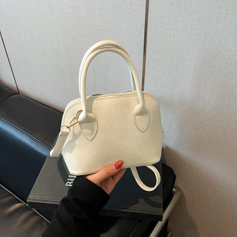 Korean Niche Fashionable Portable Shell Bag Women's 2025 Spring New Foreign Style High Value Single Shoulder Messenger Bag
