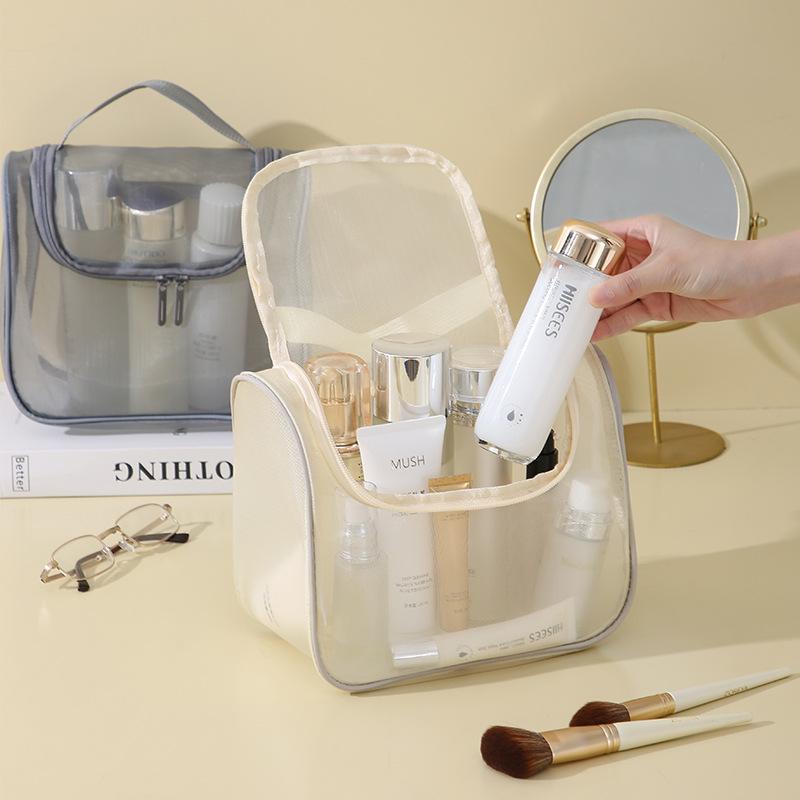 Large Capacity Mesh Makeup Bag: Portable, Multi-functional Toiletry Storage with High-Style Curved Design.