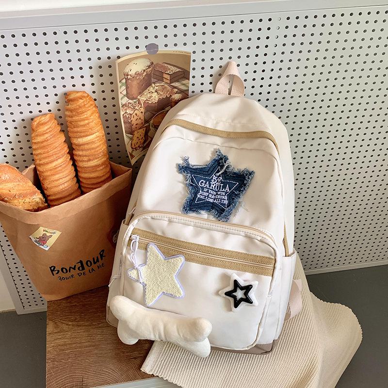 Stylish Star-print School Backpack for Junior High and High School Students. Perfect for Travel with Spacious Compartments.simple, and Trendy Design.