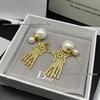 Elegant Star Earrings: Women's Inlaid Diamond Shooting Star with Large and Small Pearls and Five-Pointed Star Design.