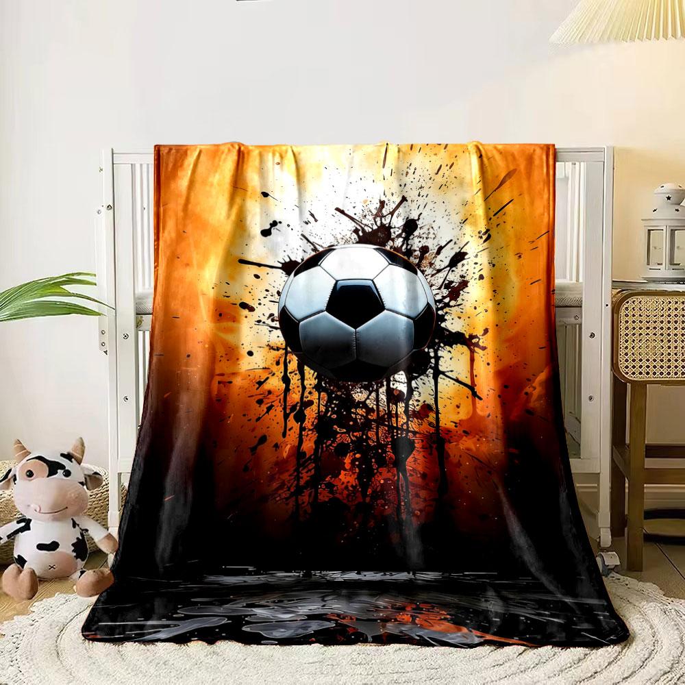 

A soccer ball with an explosive ink splatter effect on a fiery background. for all seasons blanket lunch break throw gift 80cm x 120cm