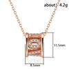 Sparkling Barrel Pendant Necklace with Textured Inlay and Central Ring Detail Modern Elegant Jewelry for Women