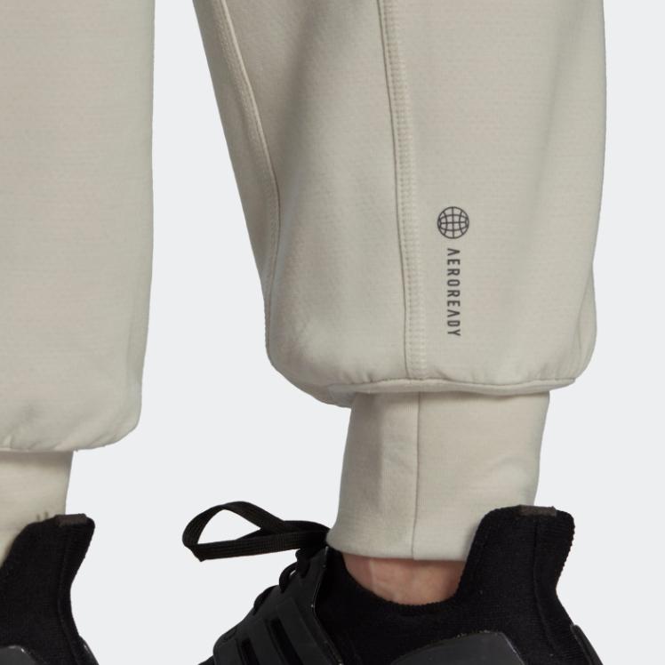 Adidas Spodnie sportowe damskie z mankietami, jednolity kolor, nadruk logo, elastyczny pas, białe HK2364