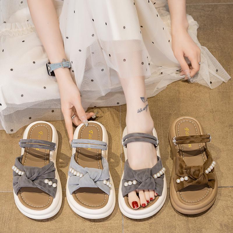 Thick-bottomed cool slippers female 2025 summer new fairy wind outside wear Internet celebrity versatile pearl bow word slippers