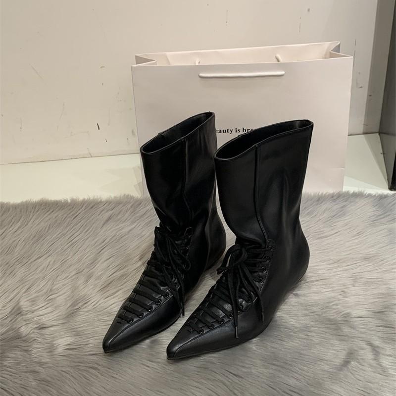 Niche pointed strap loose mouth witch boots spring new big tube circumference small high heel short boots design sense women's boots