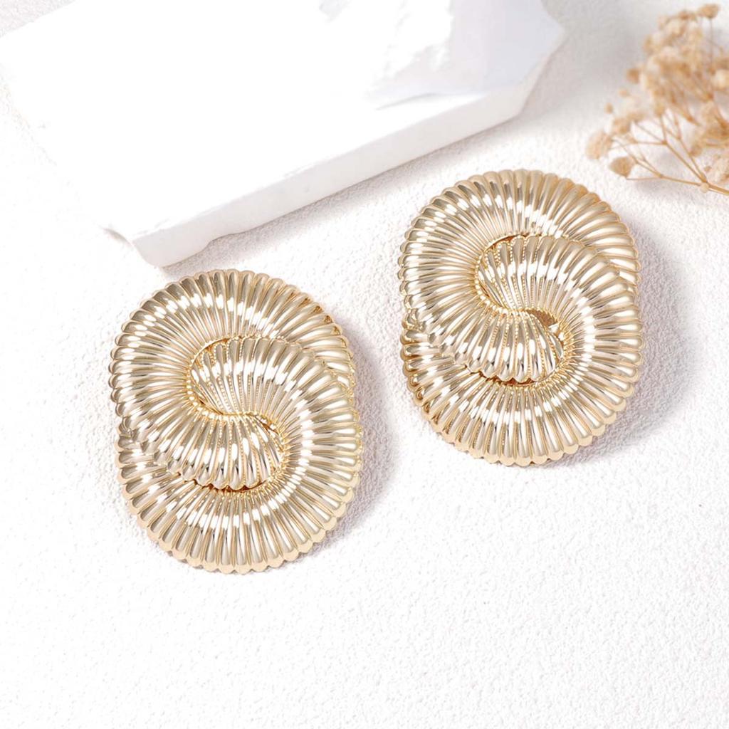 Exaggerated and powerful metal twisted spring wavy stud earrings for ladies, versatile and trendy street style for women