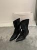 Niche pointed strap loose mouth witch boots spring new big tube circumference small high heel short boots design sense women's boots