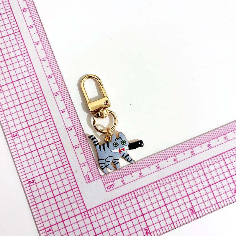 Creative Assassin Cat Keychain: Trendy Cartoon Enamel Pendant.