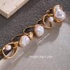 European-American Hot Selling Geometric Baroque Pearl Ring for Women - Retro Light Luxury Flower Design