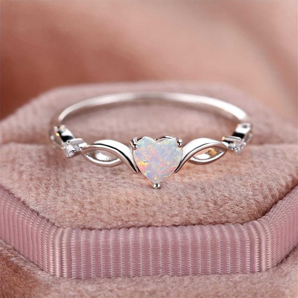 Bague couleur argent incrustée d'opale brillante en forme de cœur argentée ou rose dorée. Choisissez la couleur que vous préférez. Cadeau de Saint-Valentin de haute qualité pour femme.