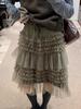 Spring 2026 Essential Korean Style Midi Skirt with Heavy Embroidery, Mesh Layers, and Lace-Up Hem.