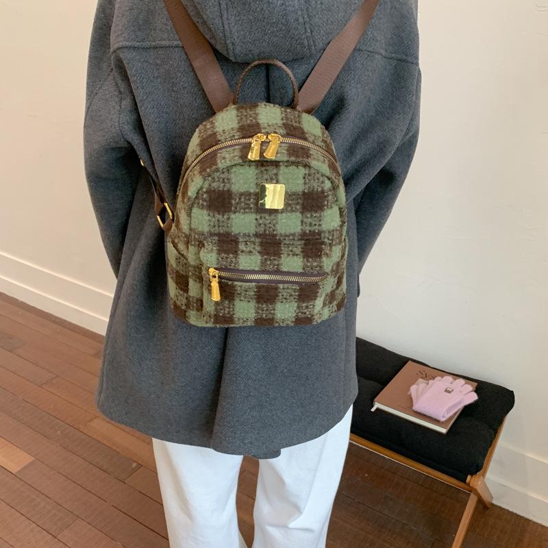 Autumn and winter popular woolen plaid backpack 2025 versatile temperament high sense women commuting niche design small bag