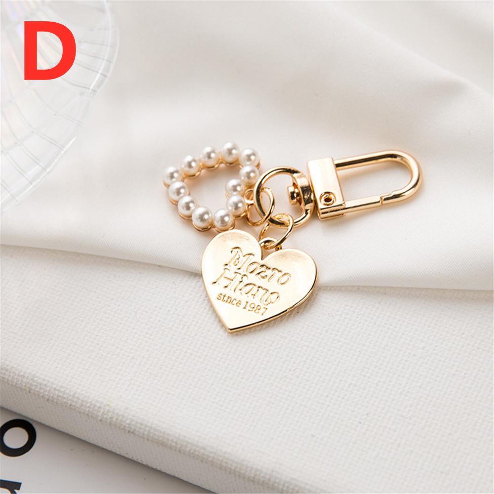 Niedlicher Perlenblumen-Schlüsselanhänger Glänzendes Muschelblatt-Schlüsselanhänger Metallanhänger Zubehör für Damen Auto Anhänger Taschenanhänger Schmuck