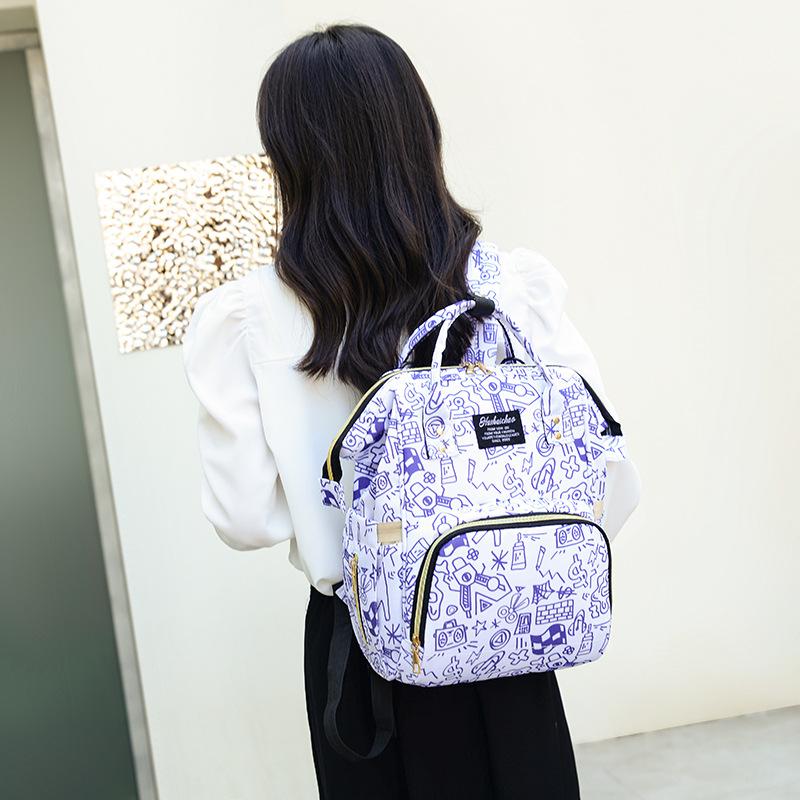Graffiti printing small fresh literary labeling backpack spring and summer new large-capacity backpack фиолетовый
