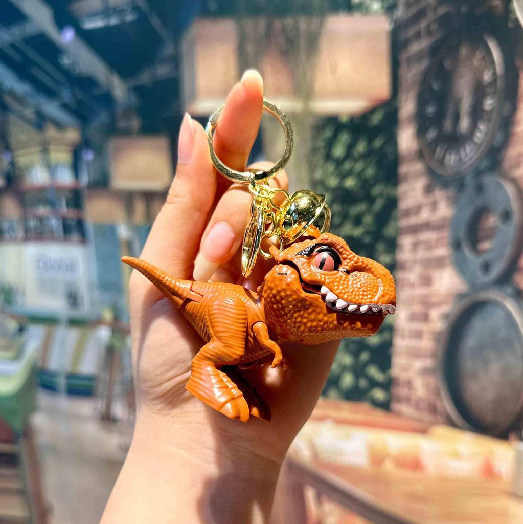 Trendy PVC Cartoon T-Rex Keychain Pendant with Dinosaur Bell and Hand-Biting Feature