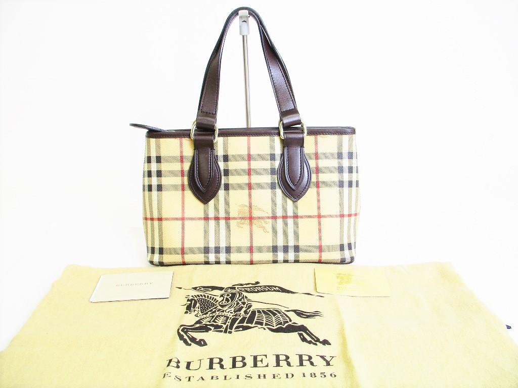 

Автентична сумка BURBERRY Hymarket у клітку коричневого кольору з ПВХ.