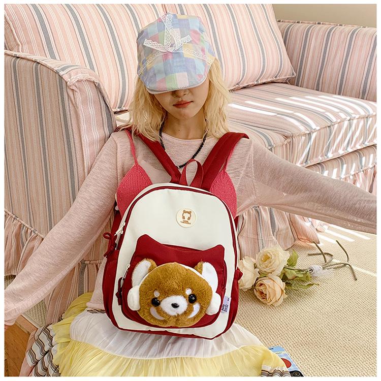 Cute Cartoon Trendy Backpack: Large Capacity, Lightweight, Versatile Travel/School Bag with Earphone and Doll Holder.