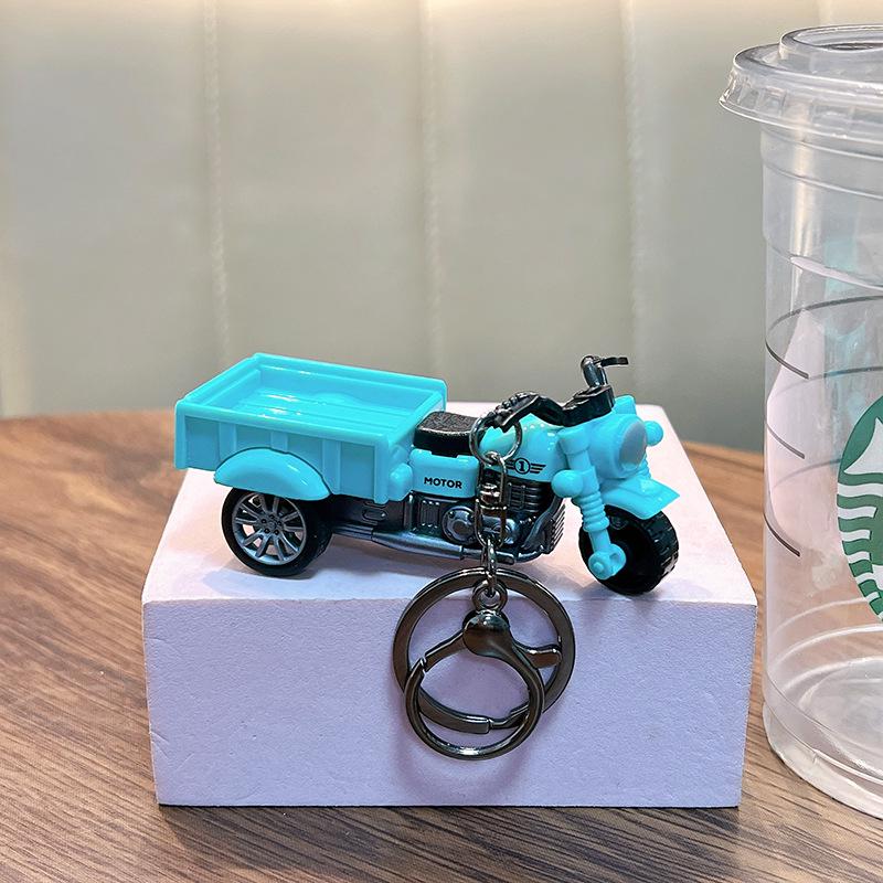 

Creative Tricycle Keychain: Pull-back Toy Car Model & Backpack Pendant Gift