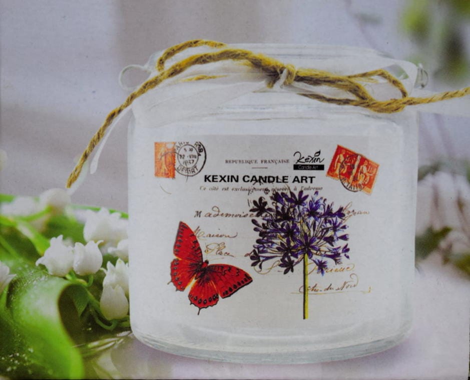 Portable glass candle holder with a butterfly for interior and patio decoration
