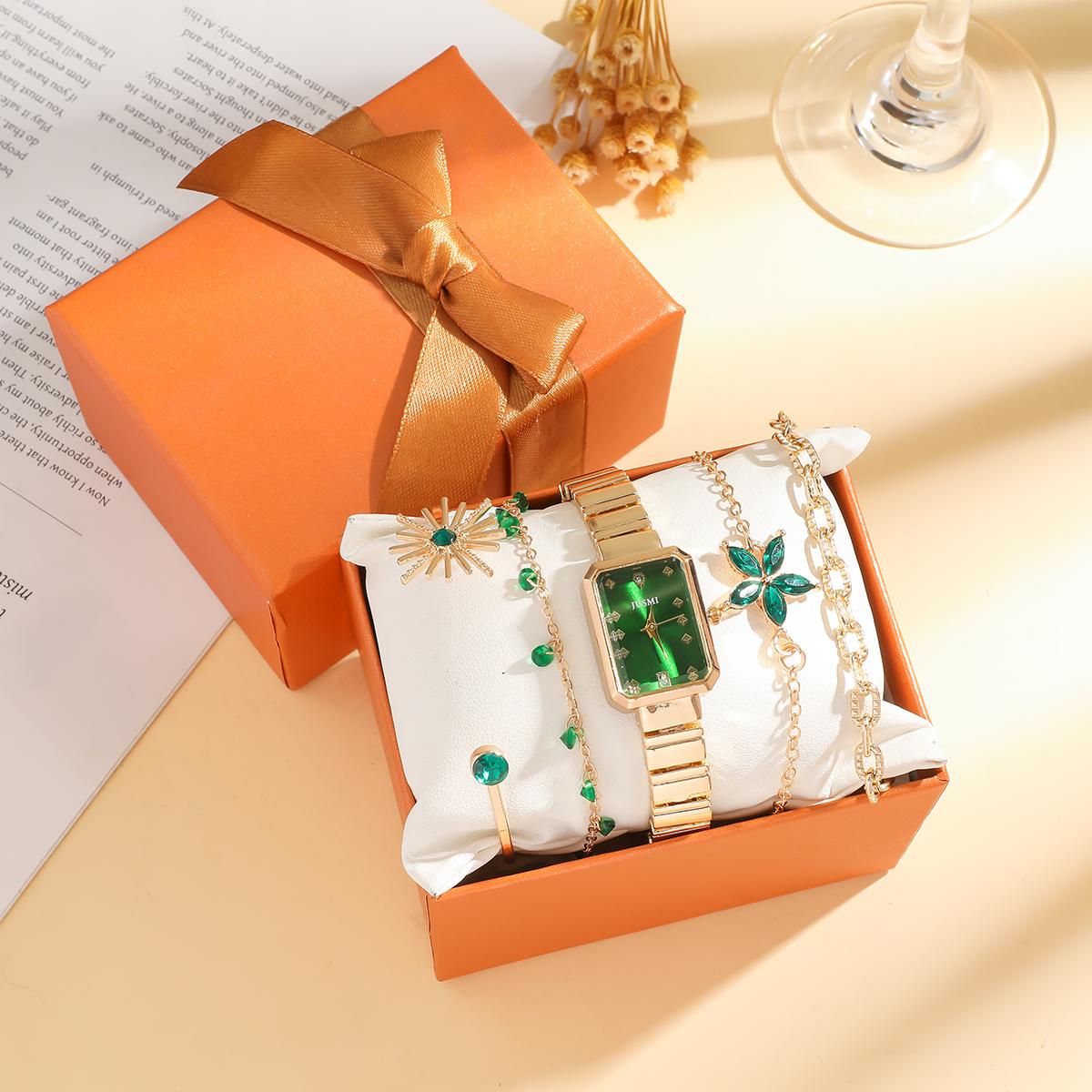 

No gift box; small square dial in dark green; simple design with metal strap and a set of five ornaments золотой