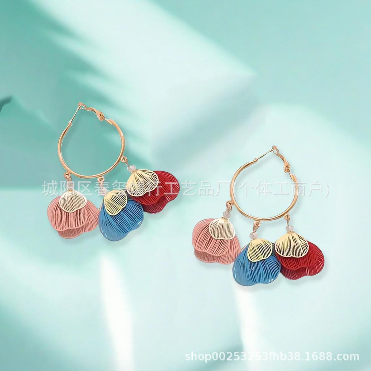 Wind retro hollow leaf fringed earrings golden branches and jade leaf earrings temperament Muse premium earrings