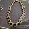 Vintage Geometric Black Gold Jewelry Set: Pre-owned Gold-plated Stud Earrings & Necklace