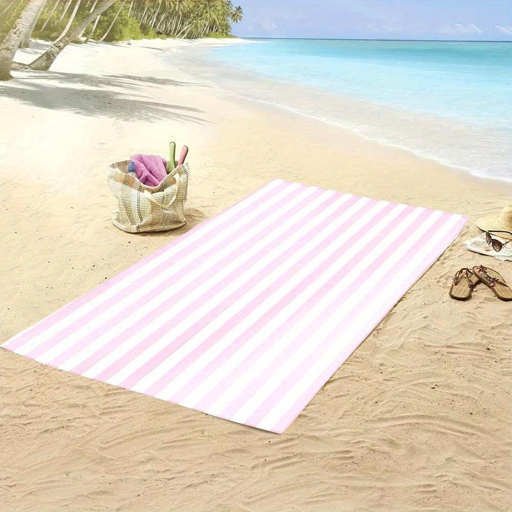 Stylish pink and white striped beach towel, made of polyester, machine washable, suitable for travel, pool, and beach decoration