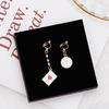 Korean girl asymmetrical playing card clock earrings, sweet Alice dripping pearl cute stud earrings