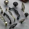 Boutons de cage à oiseaux en bronze vintage pour ajouter du charme historique aux armoires