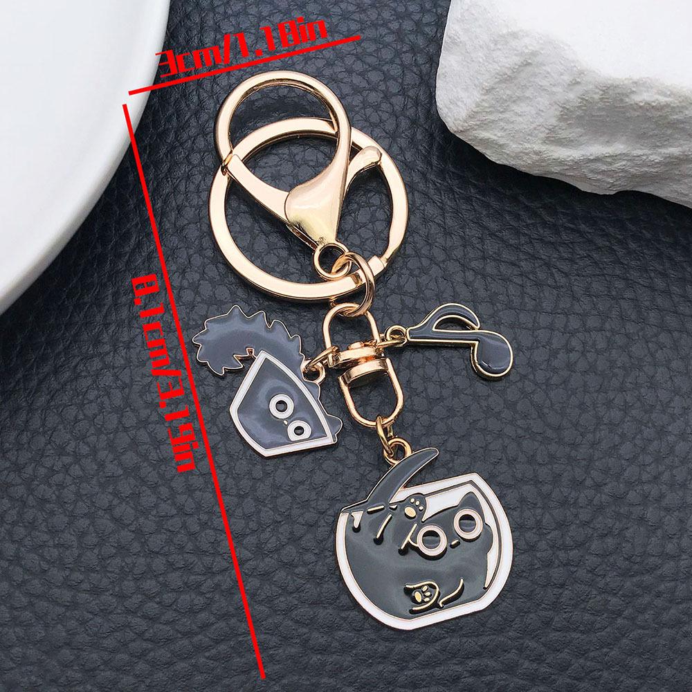 Well-Behaved Black Cat Zinc Alloy Keychain: Cute Drip Oil Cartoon Pendant for Backpacks