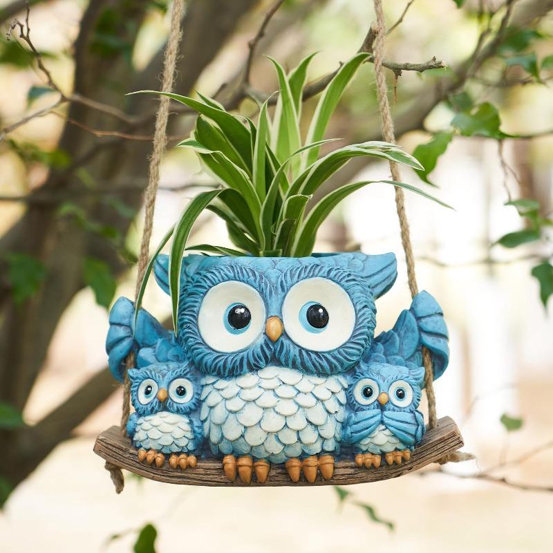 An Owl Hanging A Succulent Decoration In A Flower Pot As A Gift