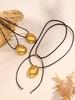 Oumika Geometric Pendant Necklace: High-Polished Stainless Steel with Black Cord, Clavicle-Length, Non-Fading, European & American Style.