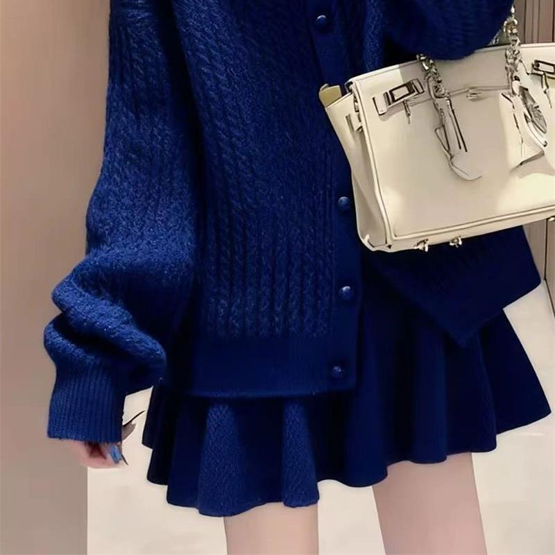 

Women s Blue Knit Two-Piece Winter Set: Cozy Top and Skirt for a Slimming, Radiant Look. Medium
