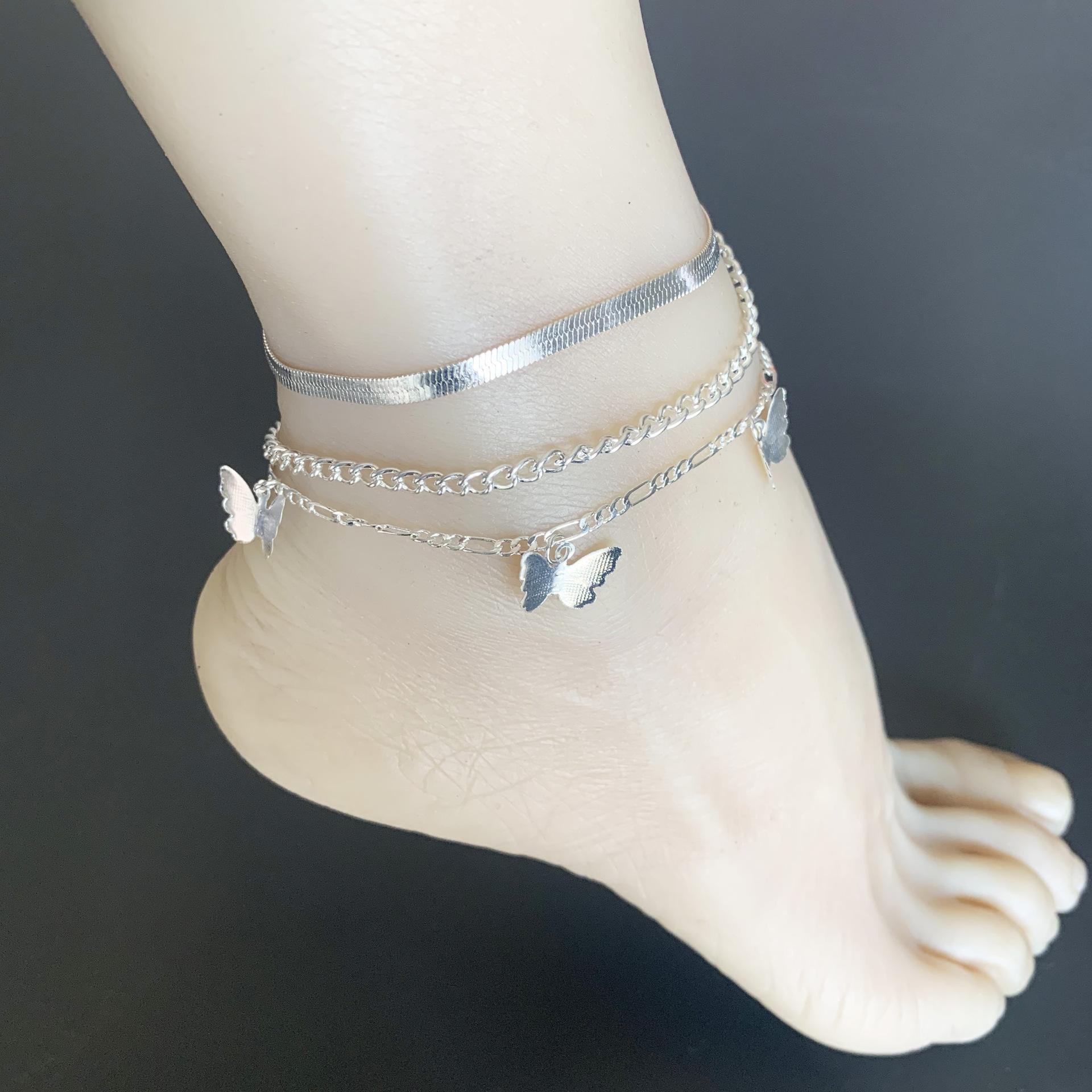 

Fashion femininity snake bone chain metal foot decoration, multi-layer butterfly three-piece set anklet срібний